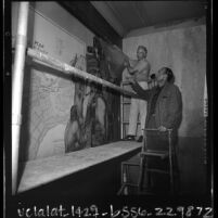 Artist Edward Biberman watching worker remove his mural from the Los Angeles Federal Building, 1965