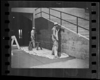 Workers painting interior wall of Santa Anita race track, Arcadia, ca. 1934