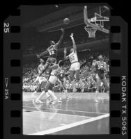 James Worthy going up for basket during Houston Rockets vs Los Angeles Lakers game, 1986