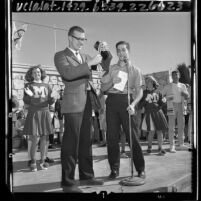 Olympic athlete and math teacher Mike Larrabee receiving award from students at Monroe High School in Los Angeles, Calif., 1964