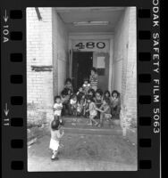 Skid Row children on door step of apartment building in Los Angeles, Calif., 1979