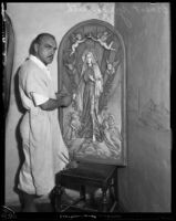 Ernest Yerbysmith, sculptor, with his work Queen of Angels in his studio, West Hollywood, 1932