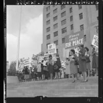 Women strike for peace, picket march in front of state building in Los Angeles, Calif., 1961