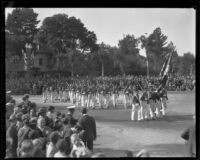 Marching soldiers carrying rifles in the Tournament of Roses Parade, Pasadena, 1930