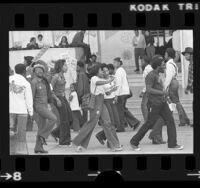 Demonstrators, part of "March for Survival," marching with placards reading "Join the March for Jobs" in Los Angeles, Calif., 1975