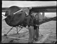 Robert Wilson and Dr. F.A. Fender with Dr. Light's seaplane, San Pedro, 1935