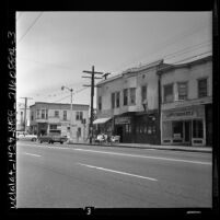 Business district with Jack's Tavern and Gospel Tabernacle on Adams Ave. in Los Angeles, Calif., 1962