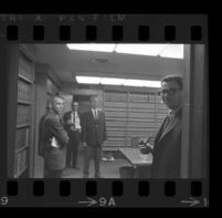 Jack Kirschke in a law office with four other men, Los Angeles, 1967