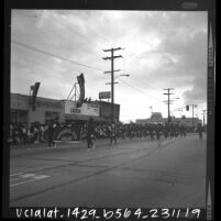 Centennial High School Apaches Girls Drill Team in the Watts Christmas parade, Los Angeles, Calif., 1965