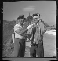 Producer Keith Daniels and singer Billy Vaughn in bandages after fire in Los Angeles, Calif., 1961