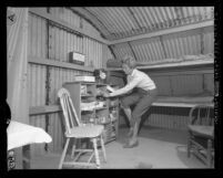 W. E. Halls in self made quonset hut-shaped fall-out shelter in San Marino, Calif., 1959