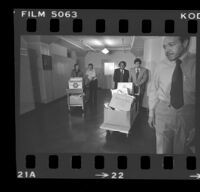 State Senator Alan Robbins and Reverend W. C. Jackson wheeling antibusing initiative petitions into the Los Angeles County Registrar-Recorder's office, 1978