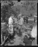 Medical attention is given to victims of the fire in Griffith Park, Los Angeles, 1933