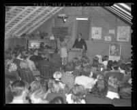 Pastor Dan Cleveland in front of congregation at Union Gospel Church, El Monte, Calif., 1939