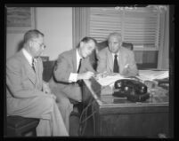 Franchot Tone signs waiver as District Attorney S. Ernest Roll (right) and personal attorney Henry Herzbrun (left) look on, Los Angeles, 1951