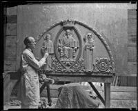 Sculptor Frederick P. Humphrey working on bas-relief of Christ in Majesty, Pasadena, 1932