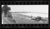 Wide angle view of Pacific Coast Highway and Santa Monica Beach, Calif., 1976