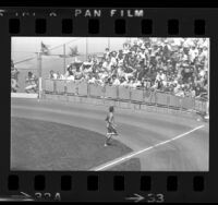 Male streaker running across field during Los Angeles Dodgers game, 1974