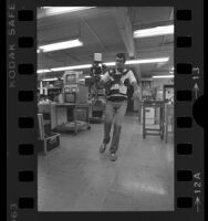 Engineer and developer John Jurgens demonstrating Steadicam camera in Los Angeles, Calif., 1978