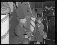 Shy girl visits Santa Claus, Los Angeles vicinity, 1938