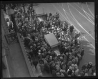 Crowd gathers around stunt driver Hayward Thompson’s car, Los Angeles, 1927