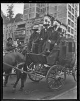 Governor Merriam, Governor Allred, and Buck Jones ride a horse drawn carriage, Los Angeles, 1936