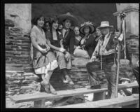 Spanish dancers relax during the Fourth of July celebration at Mission San Fernando Rey de España, Los Angeles, 1922