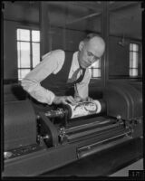 Man receiving wirephoto of woman, Los Angeles, 1935