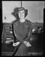 Shirley Ross, actress and singer, seated on a rolltop desk, 1933