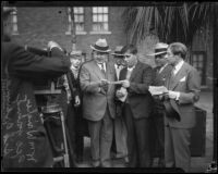 George Young, winner of the Wrigley Ocean Marathon, receives a check from William Wrigley, Jr., Los Angeles, 1927