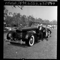 Car designer Gordon Buehrig with original Cord Sportsman automobile, Calif., 1965