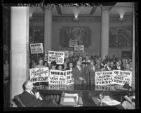 Placard-bearing citizens protesting Harbor Freeway project at Los Angeles County Board of Supervisors meeting in 1947