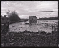 Flooded San Gabriel River where a bridge once stood, El Monte, 1921