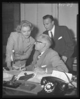 Barbara Payton with Attorney Milton Golden (right) and Superior Judge Elmer Doyle (center) after receiving final papers for her divorce from Franchot Tone, Los Angeles, 1953