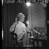 Actress Janet Leigh in animated gestures during press conference in Los Angeles, Calif., 1964