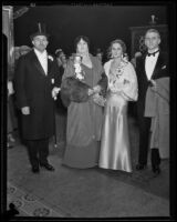 Two women and one man on opening night of the Grand Opera at the Philharmonic Auditorium, Los Angeles, 1932