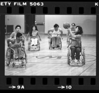 Women's wheelchair basketball team, Southern California Sunrise playing game in Los Angeles, Calif., 1980