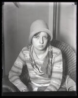 Eunice Pringle sits on a chair in an office during Alexander Pantages rape trial, Los Angeles, 1929