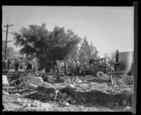 Men with shovels clearing debris after a catastrophic flood and mudslide, La Crescenta-Montrose, 1934