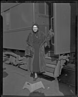 Mrs. Fay Webb Vallee, wife of bandleader Rudy Vallee, at a train station, 1933