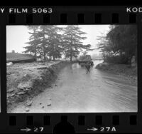 Road crew clearing mudslide from road in La Crescenta, Calif., 1978