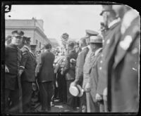 Aimee Semple McPherson is hoisted through the crowd upon her arrival, Los Angeles, 1926