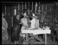 Nurse giving shot to a food aid provider (?) after the failure of the Saint Francis Dam and resulting flood, Santa Clara River Valley, 1928