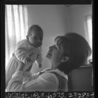 Nancy Sorio Hernandez with her infant daughter Delvina, Calif., 1966