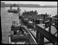 Sailors tend their tenders at the Navy dock, San Pedro, 1933