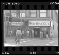 People outside pawn shop and Hard Rock bar in downtown Los Angeles, Calif., 1983