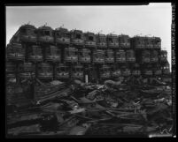 Pacific Electric Railway cars piled atop one another at junkyard on Terminal Island, Calif., 1956