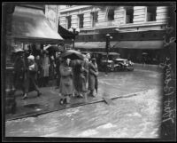 Flooded intersection of 7th and Broadway during torrential rainstorm, Los Angeles, 1926