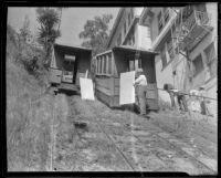 Court Flight cable cars halted during repairs, as civic workers walk up the hill, Los Angeles, 1936