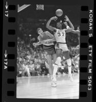 Magic Johnson and Trail Blazer's Sam Bowie playing in Lakers game in Los Angeles, Calif., 1985